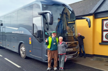 visitor coach with guide-leader Ger 